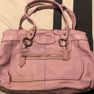 Coach purse lavender in color.